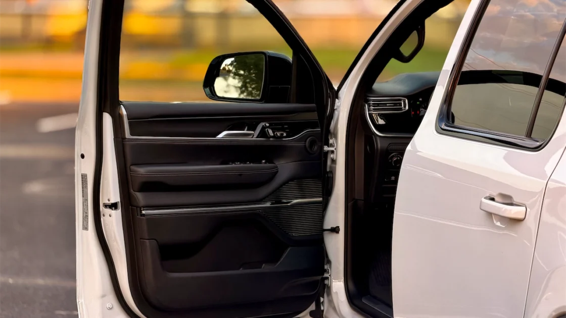 Open front door showing black leather door panel