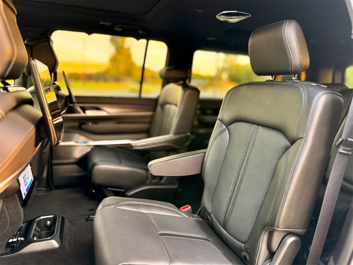 Interior of a luxury vehicle showcasing front seats with leather upholstery and modern design.