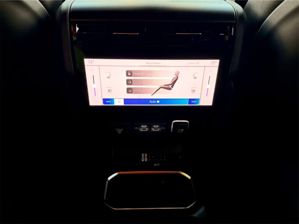 Car dashboard display showing climate control settings with temperature set to 72° and various adjustments for rear comfort.