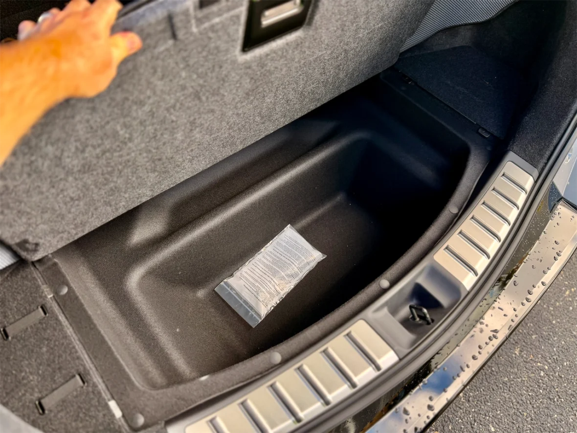 Underfloor storage in the cargo area of the 2026 Lexus RZ 550e