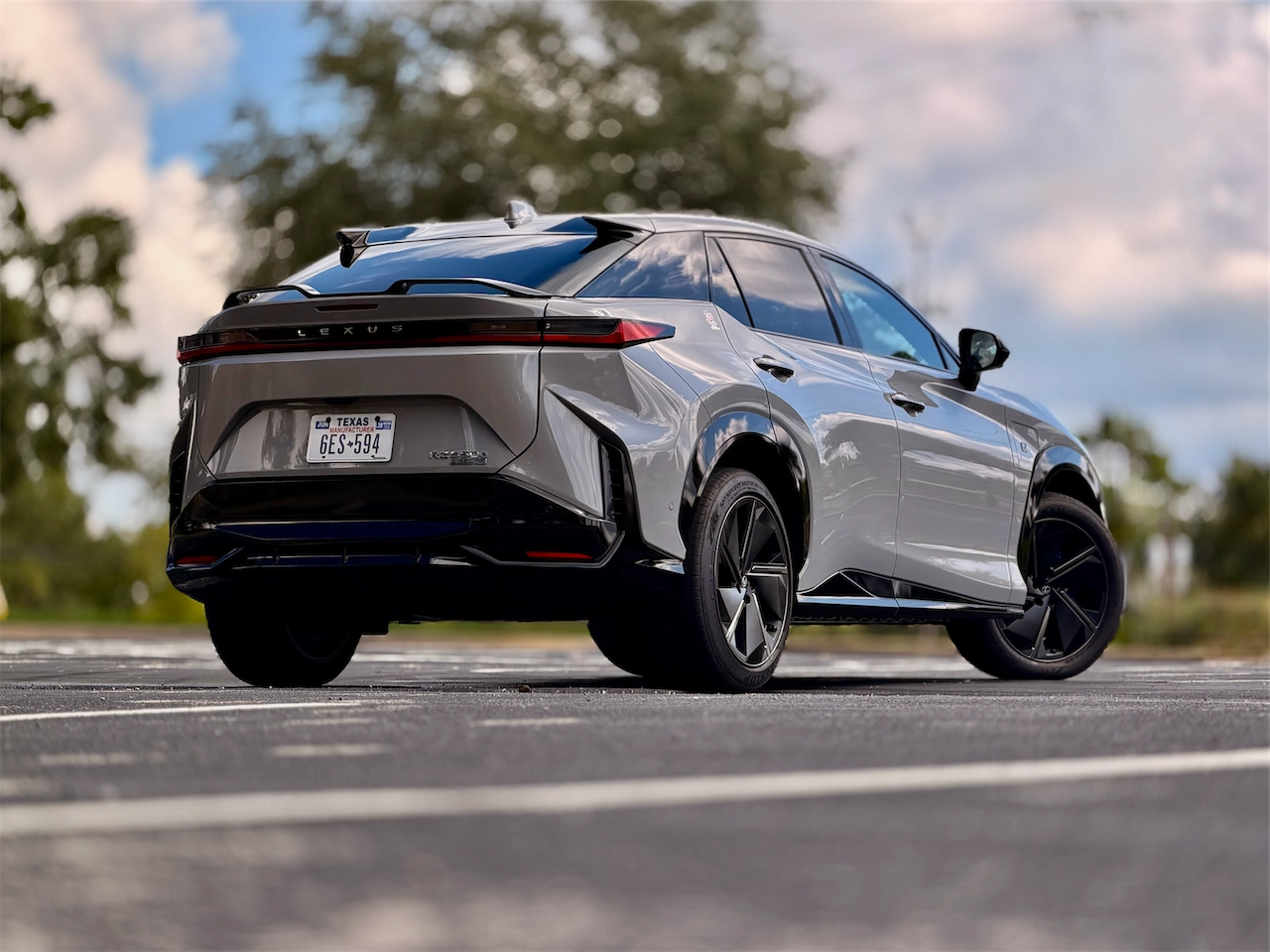 Rear three-quarter view of the 2026 Lexus RZ 550e F SPORT AWD