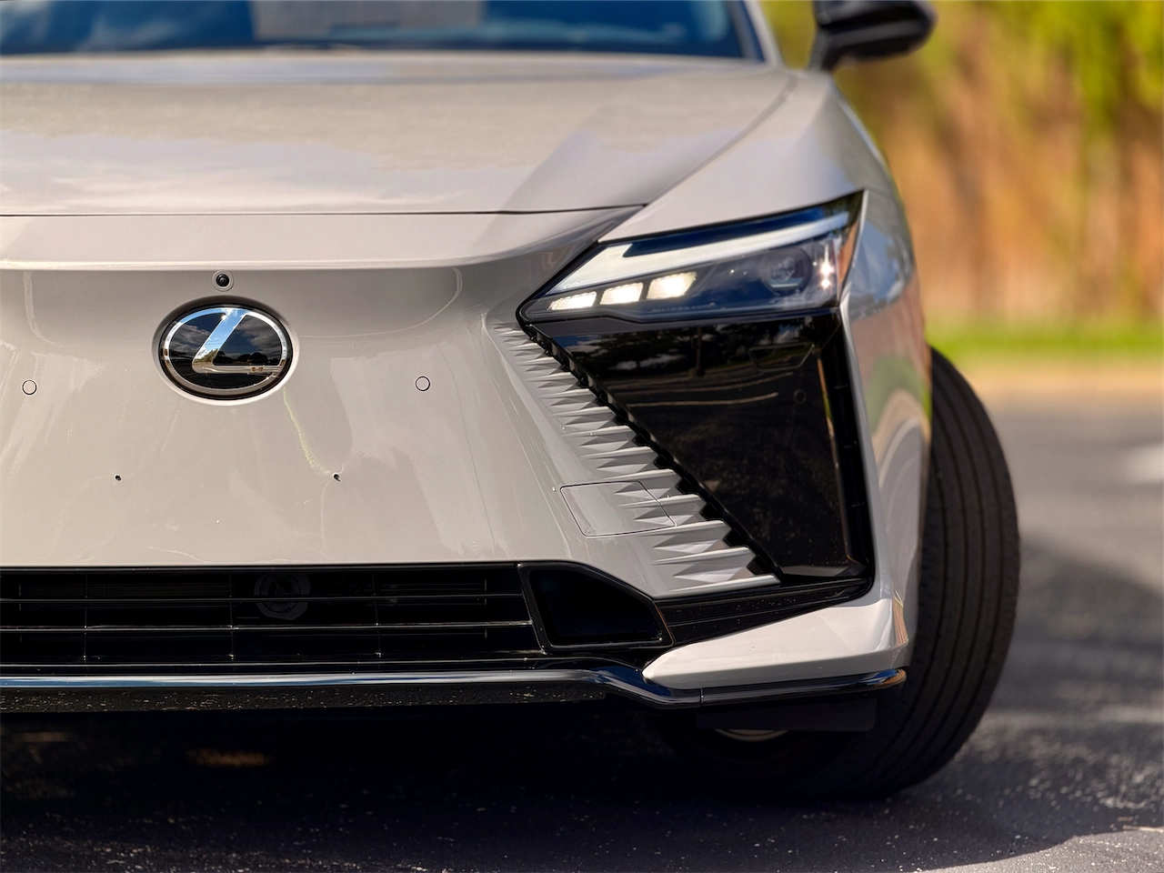 Solid body-color grille and LED lighting on the 2026 Lexus RZ 550e F SPORT