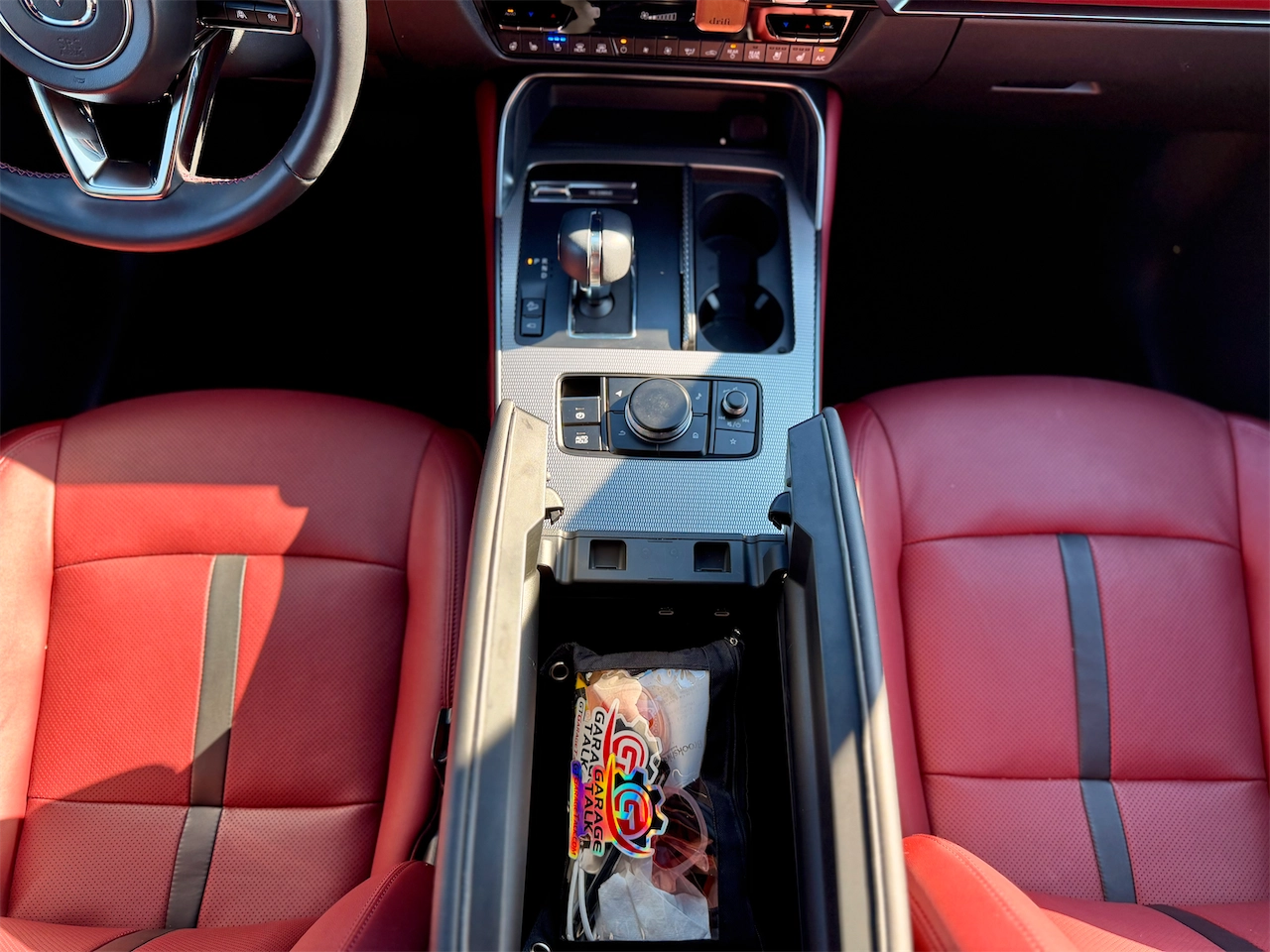Center console command knob and shifter in red leather cabin