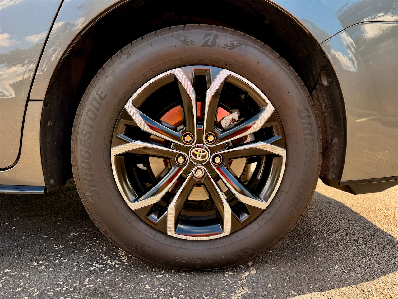 18-inch wheel with a two-tone wheel cover on the 2026 Toyota Sienna Platinum