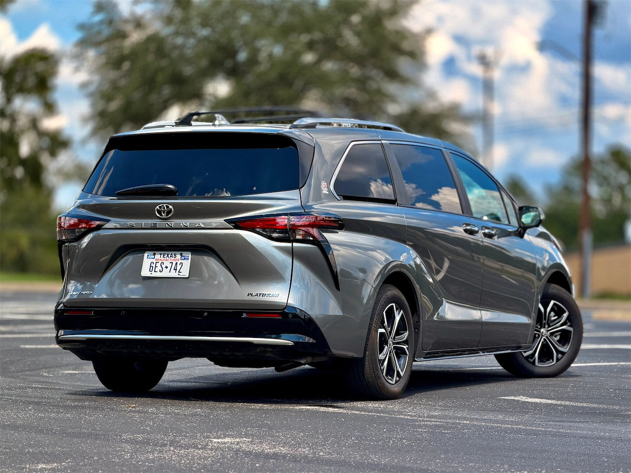Rear three-quarter view of the 2026 Toyota Sienna Platinum AWD