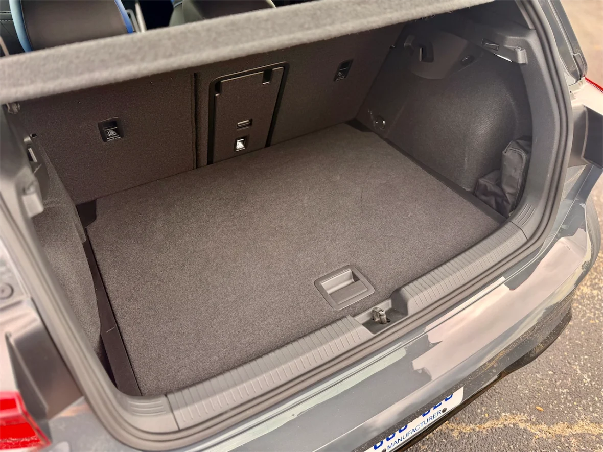 The interior view of a car trunk showcasing a spacious, carpeted storage area with no visible items.