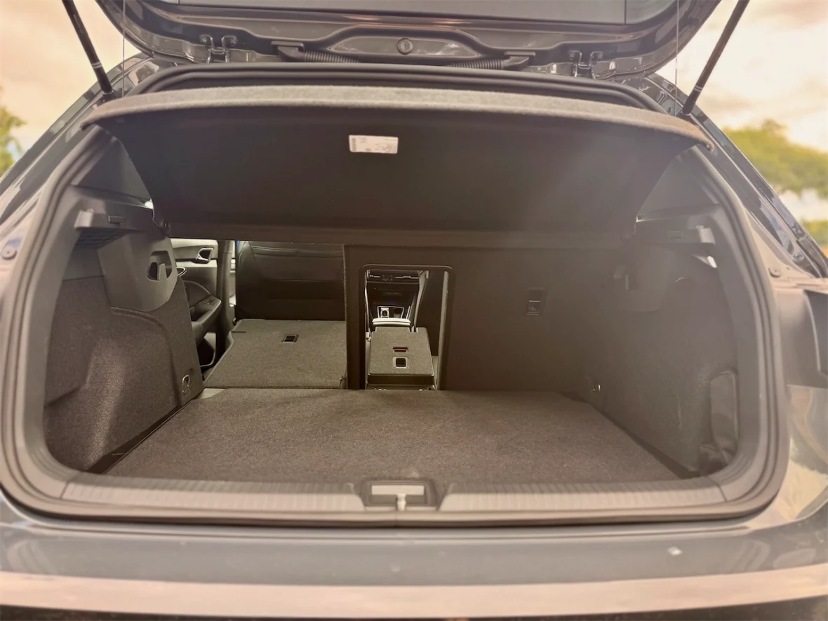 Interior view of an open car trunk, showcasing a spacious cargo area with a flat floor and no visible items inside.
