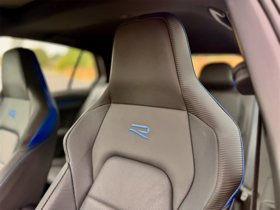 Close-up of a modern car seat featuring a stylish design and blue accents.