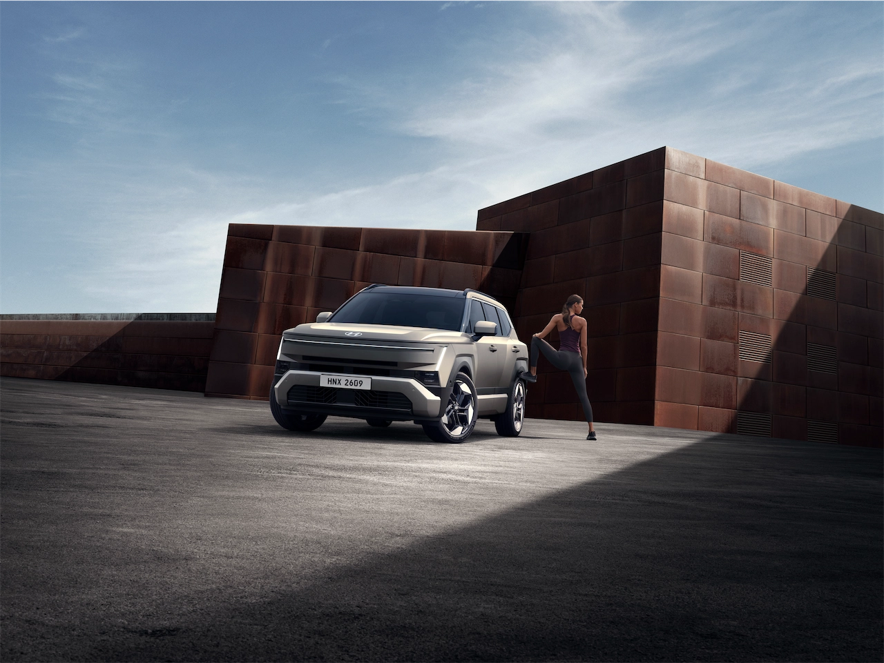 2027 Hyundai Tucson parked near a modern building