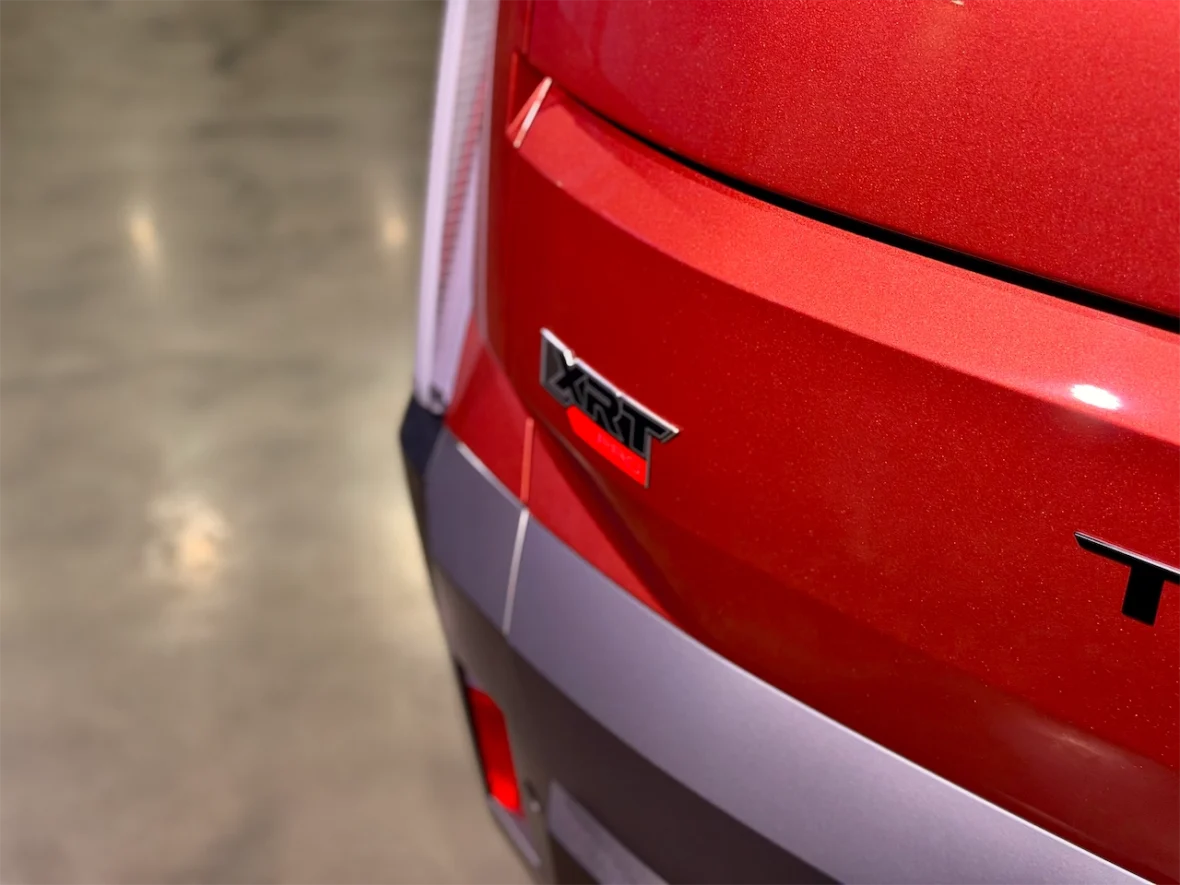Close-up view of the rear badge of a red vehicle featuring the 'XRT' and 'TRD' logos.