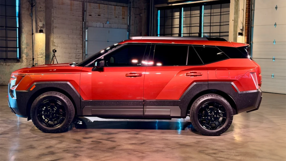 Side profile of the orange 2027 Hyundai Tucson XRT PRO