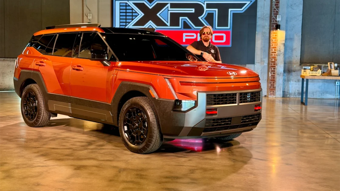 Front three-quarter view of the orange 2027 Hyundai Tucson XRT PRO in Bentonville, Arkansas