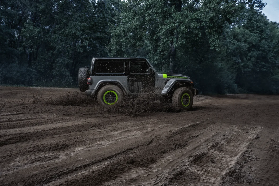 Jeep Wrangler Switchback driving on a dirt trail