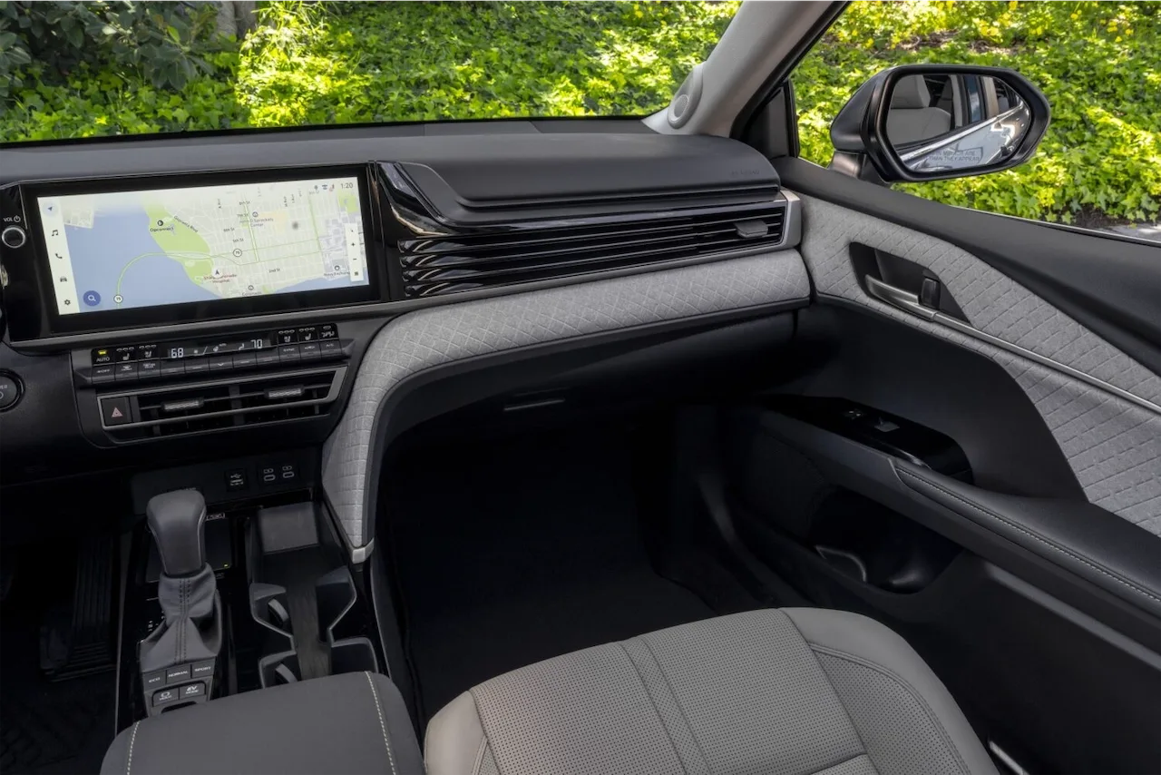 Light gray dashboard and touchscreen inside a Toyota Camry XLE