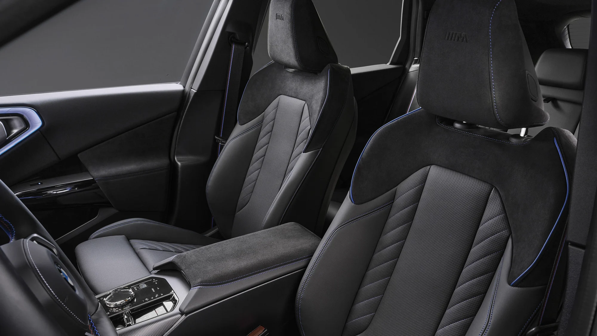 2027 BMW X3 M50 Black Package front seats in black Alcantara and Veganza with blue stitching