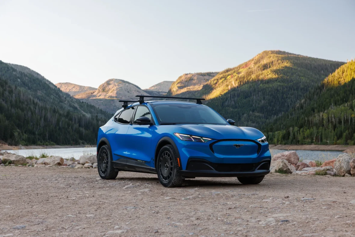 2027 Mustang Mach-E Trail parked in front of a mountain lake