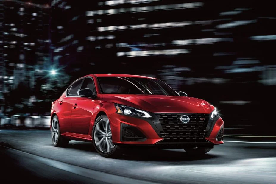 2027 Nissan Altima parked on a city street at night