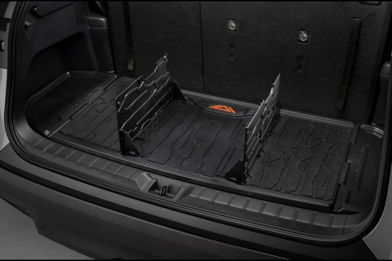 Cargo tray with pop-up dividers in the 2027 Toyota Grand Highlander Woodland Edition