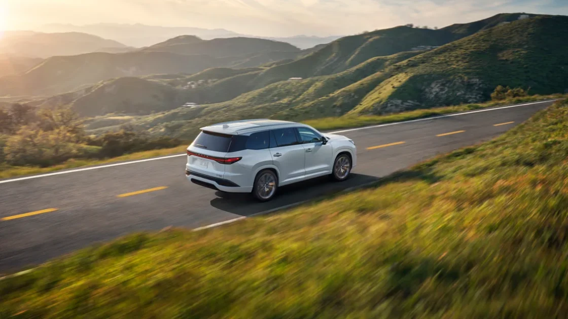 2027 Lexus TX driving on a scenic road