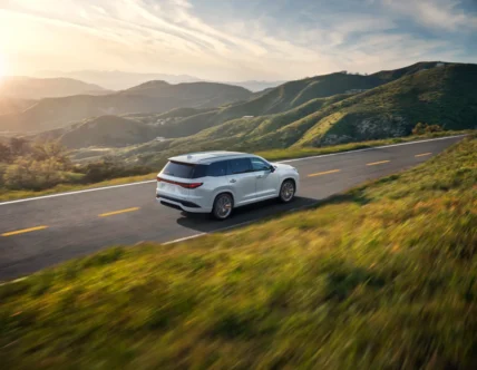2027 Lexus TX driving on a scenic road