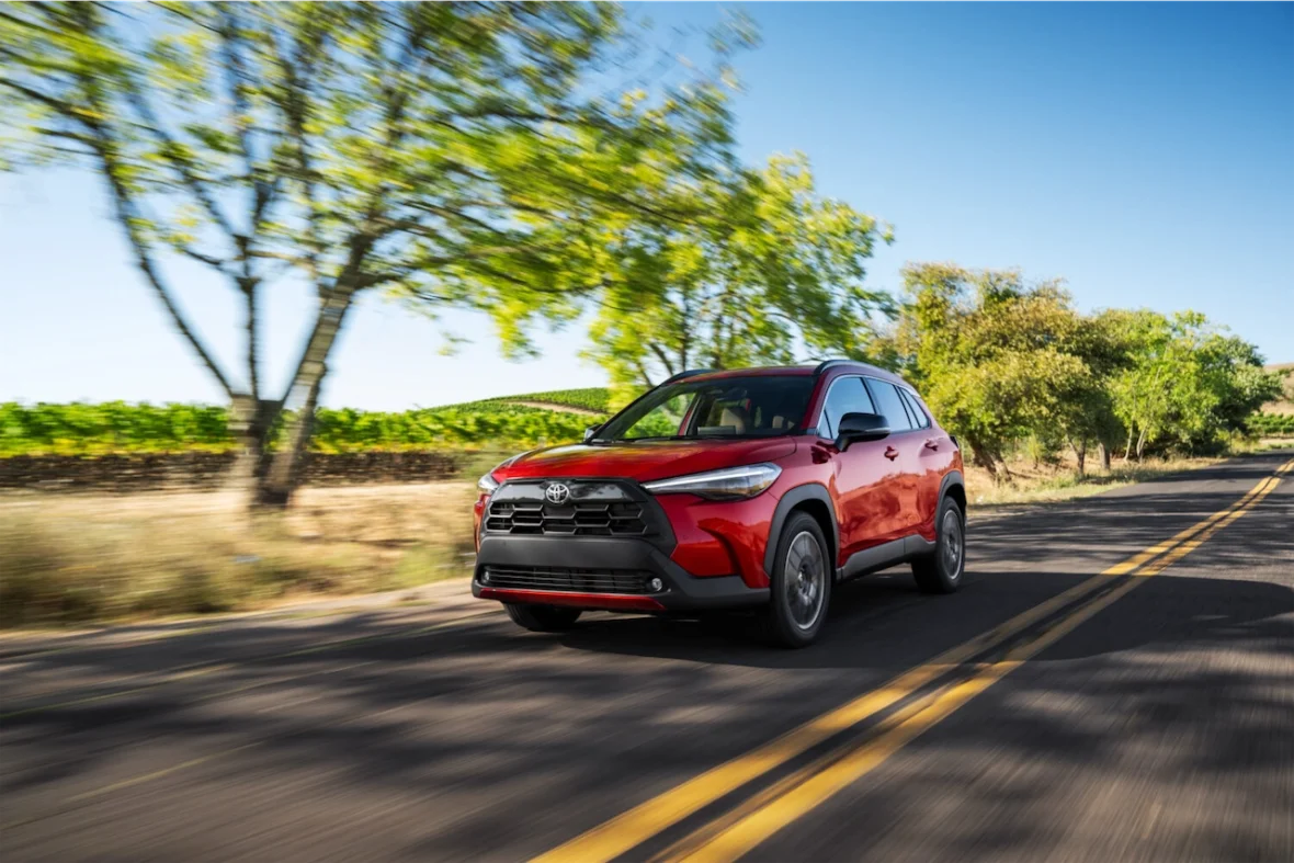 Corolla Cross XLE driving on a sunny road