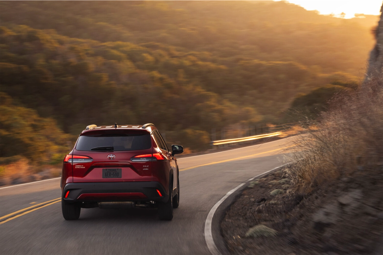 2027 Toyota Corolla Cross XLE driving on a winding road
