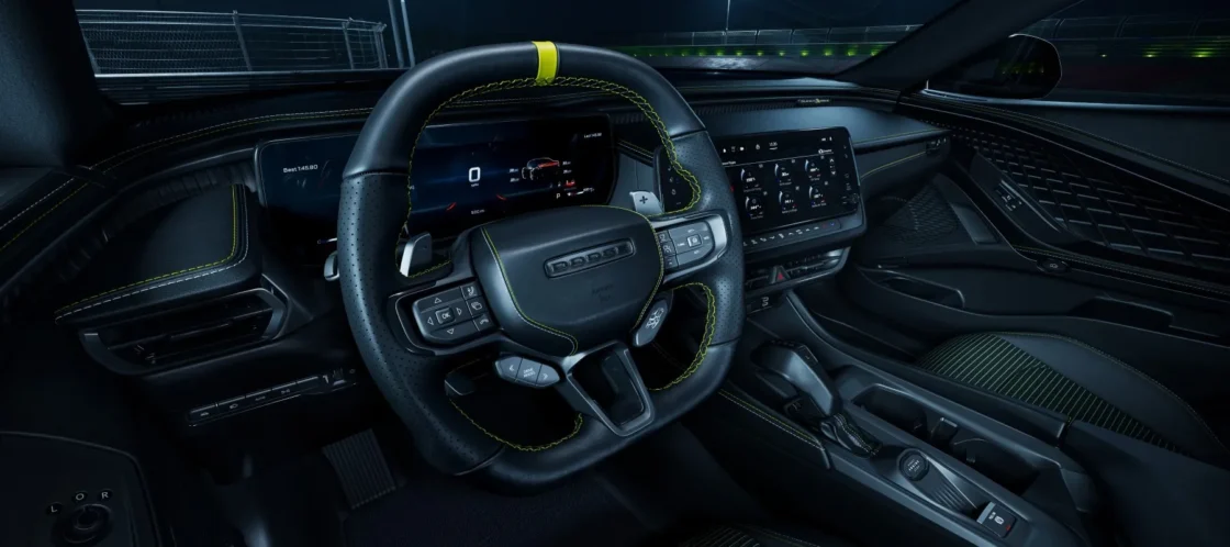 Dodge Charger Super Bee interior with yellow-striped steering wheel and digital gauge cluster