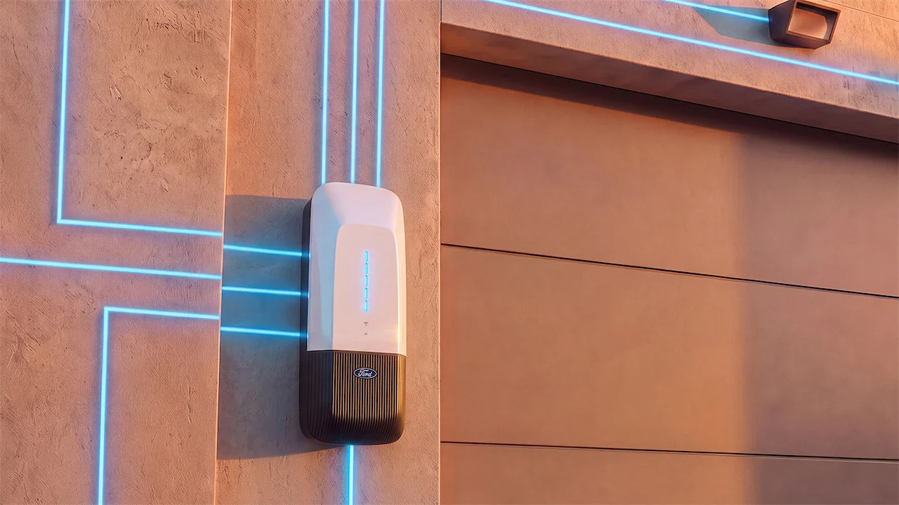 A modern electric vehicle charging station mounted on a wall, with illuminated blue lines enhancing its design.