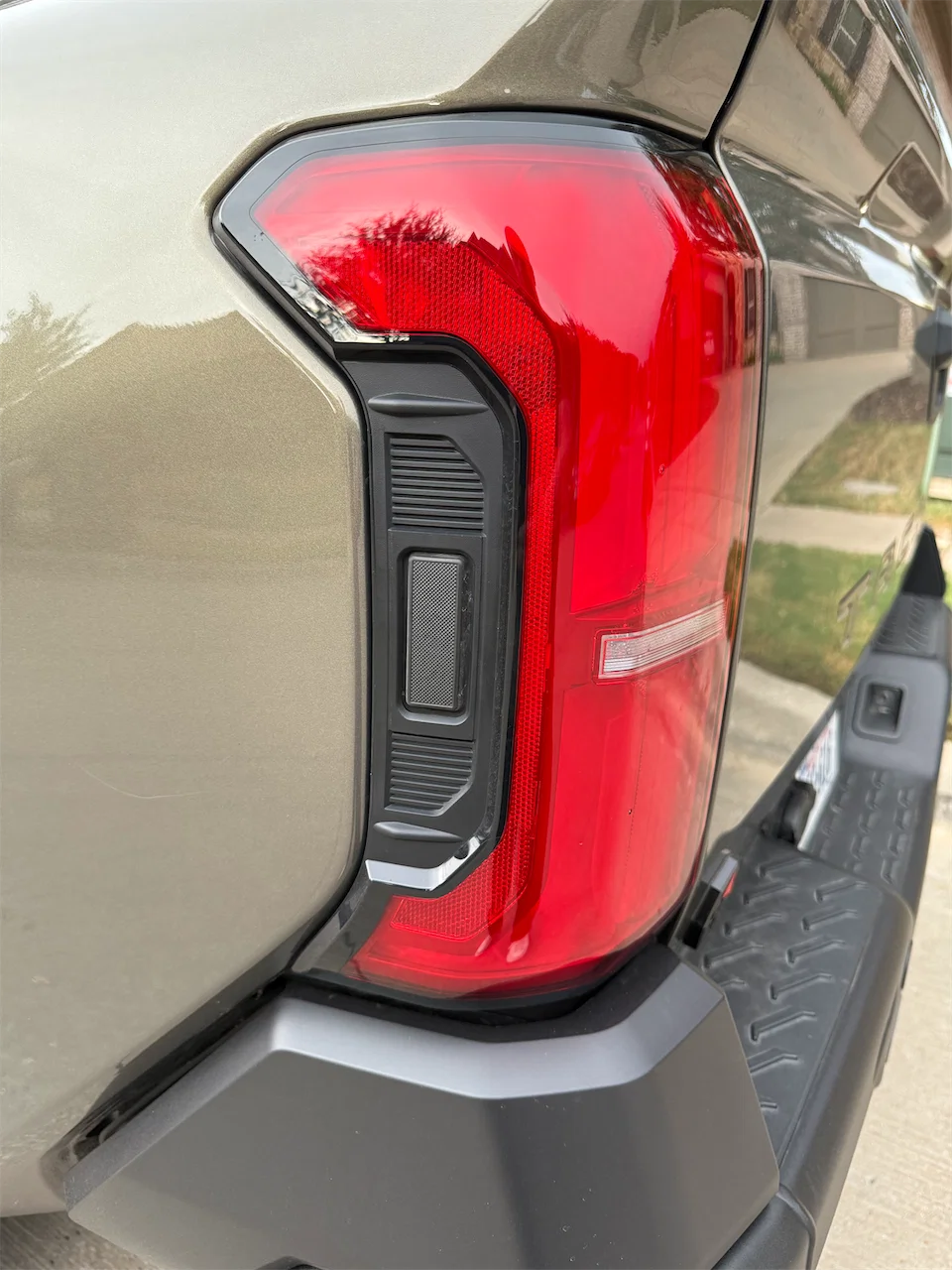 Taillight detail on the 2026 Toyota Tacoma Trailhunter in Bronze Oxide.