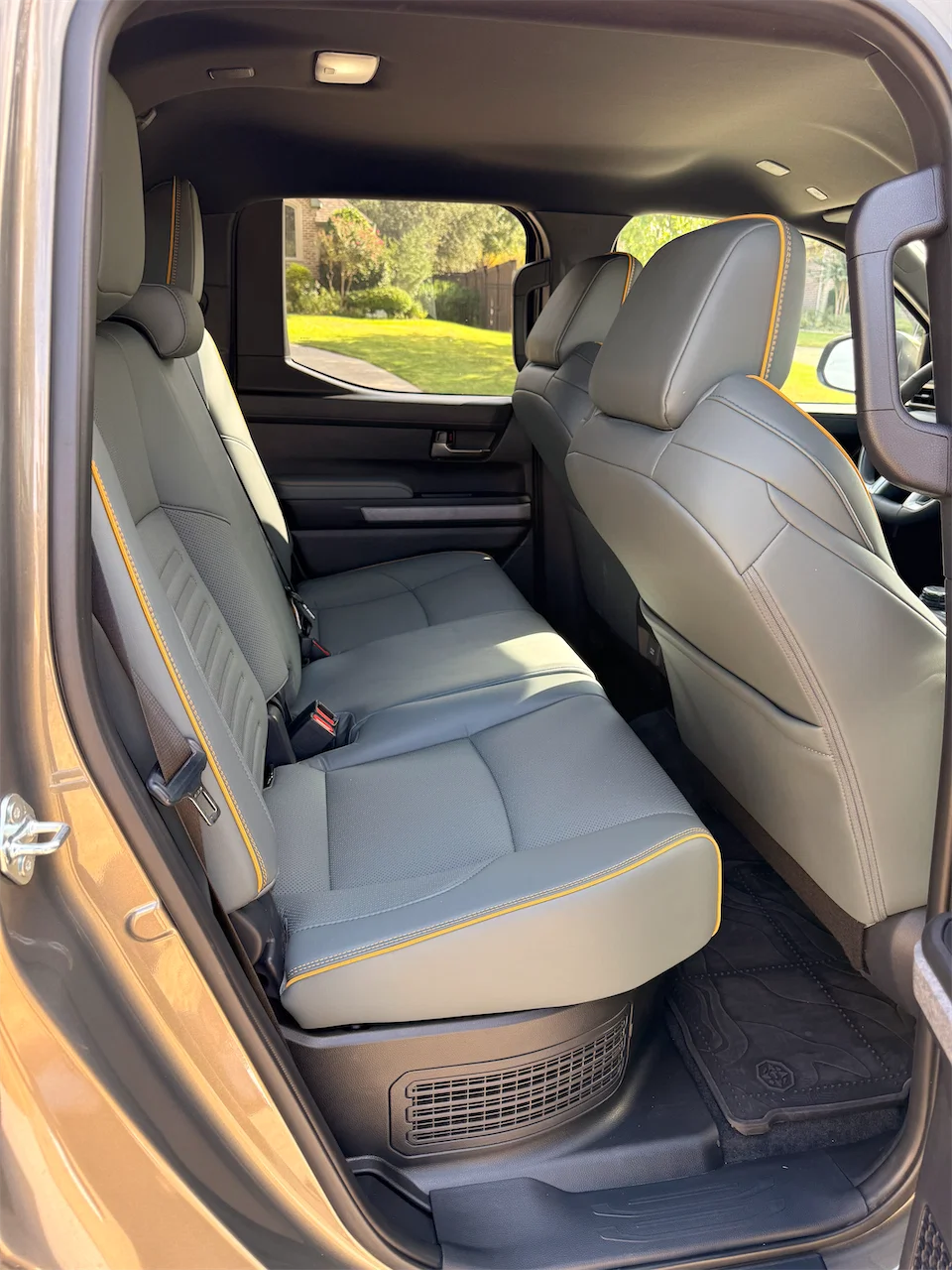 Rear seat of the 2026 Toyota Tacoma Trailhunter Double Cab with SofTex upholstery and contrast stitching.