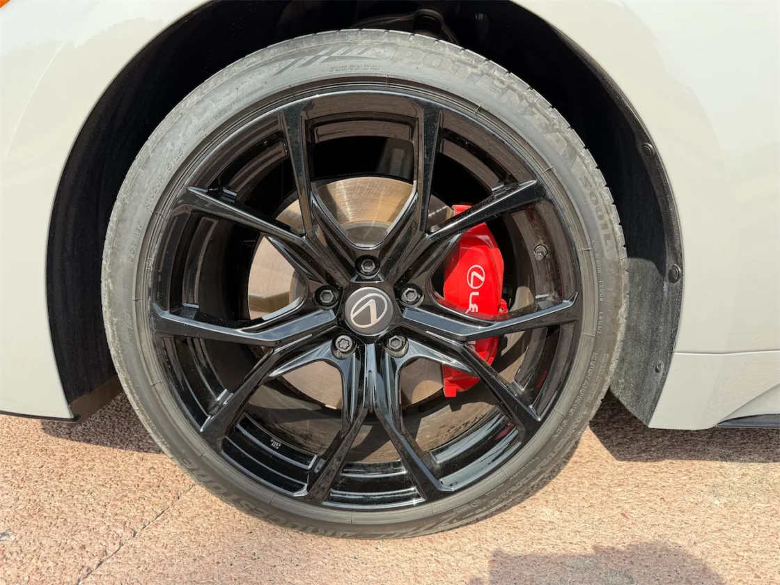 19-inch gloss black wheel and red brake caliper on the 2026 Lexus IS 350 F SPORT