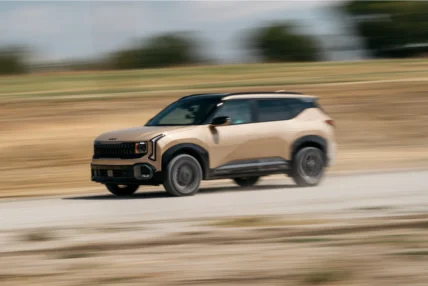 2027 Kia Seltos X-Line SX AWD kicking up dust on a dirt rally course