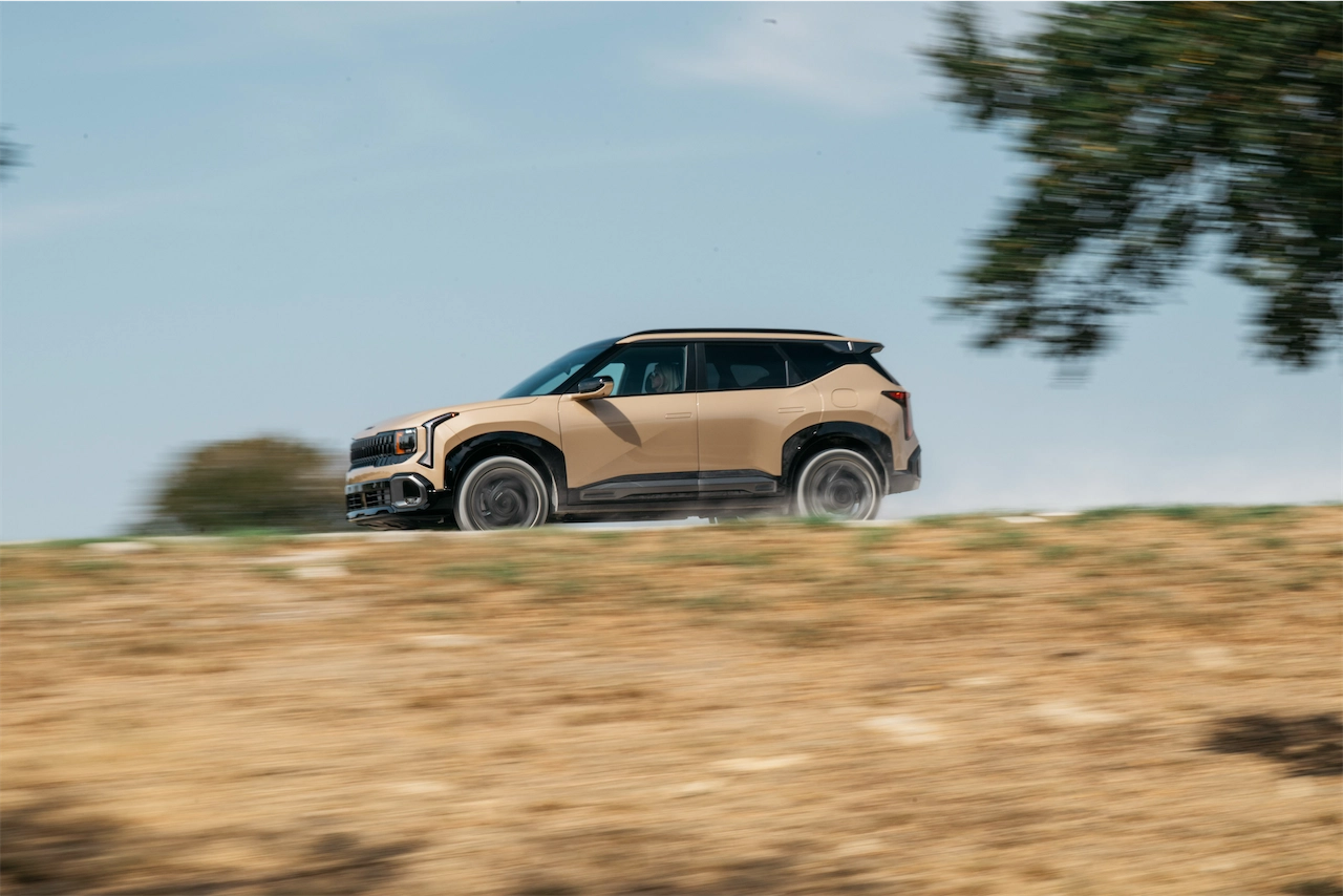 2027 Kia Seltos X-Line SX AWD speeding along a dirt road