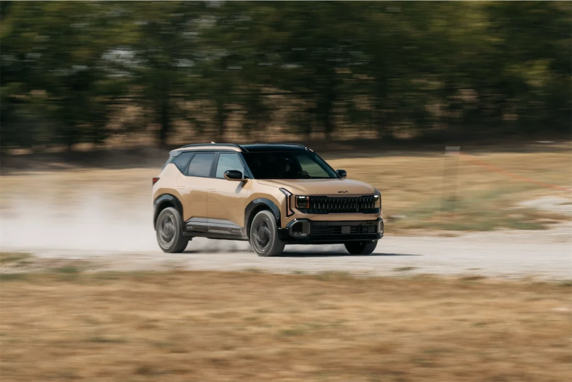 2027 Kia Seltos X-Line SX AWD sliding through a dirt corner