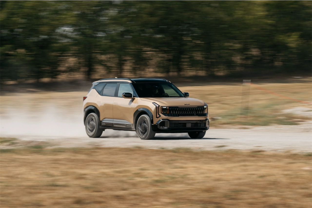 2027 Kia Seltos X-Line SX AWD sliding through a dirt corner