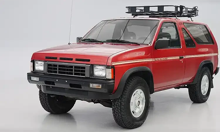 Red Nissan Pathfinder three-quarter view