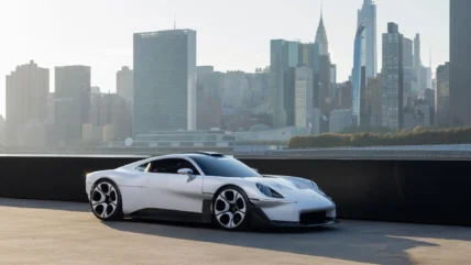 Porsche Mission S on a pier in Queens with the Manhattan skyline