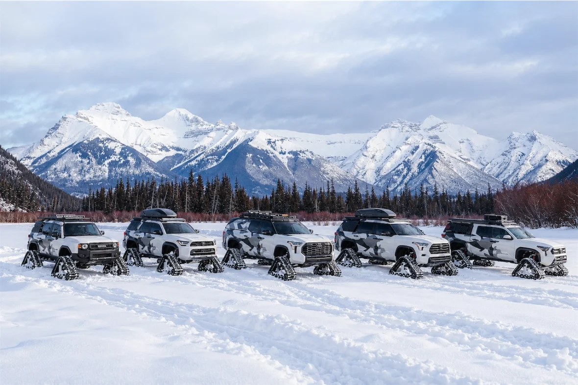 The five Toyota Snowhunter concepts line up in front of a snow-capped mountain range.