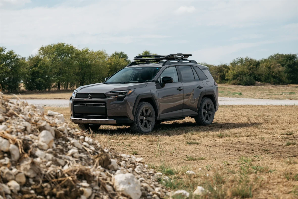 2026 Toyota RAV4 PHEV Woodland next to a gravel pile