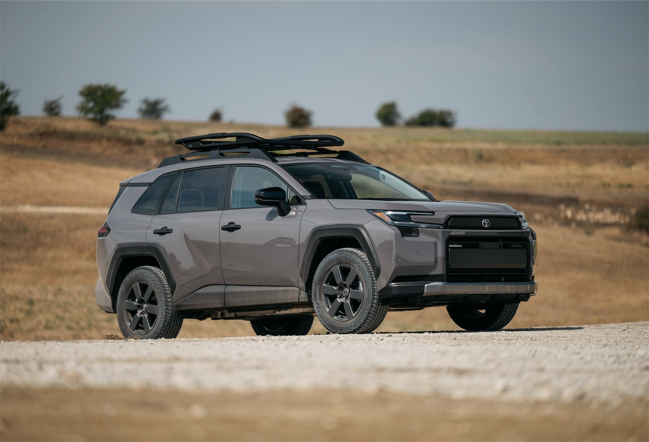 Side view of the 2026 Toyota RAV4 PHEV Woodland with a roof basket