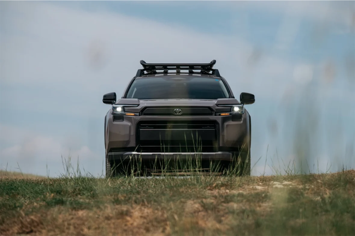 Front view of the 2026 Toyota RAV4 PHEV Woodland on a hilltop