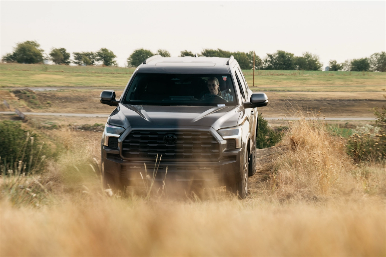 Front view of the 2027 Toyota Sequoia Trailhunter pushing through tall grass