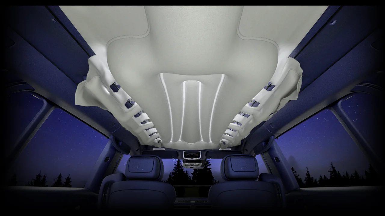Genesis GV90 safety roof airbag deployed across the glass roof