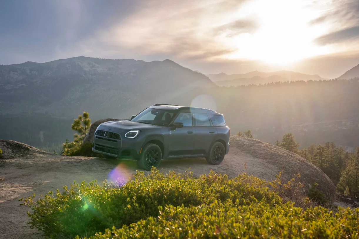 MINI Countryman Untamed Edition parked on a mountain overlook at sunset